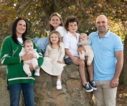 george and kayla whitlock standing with their five children