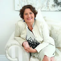 Bev Latwon sitting on couch