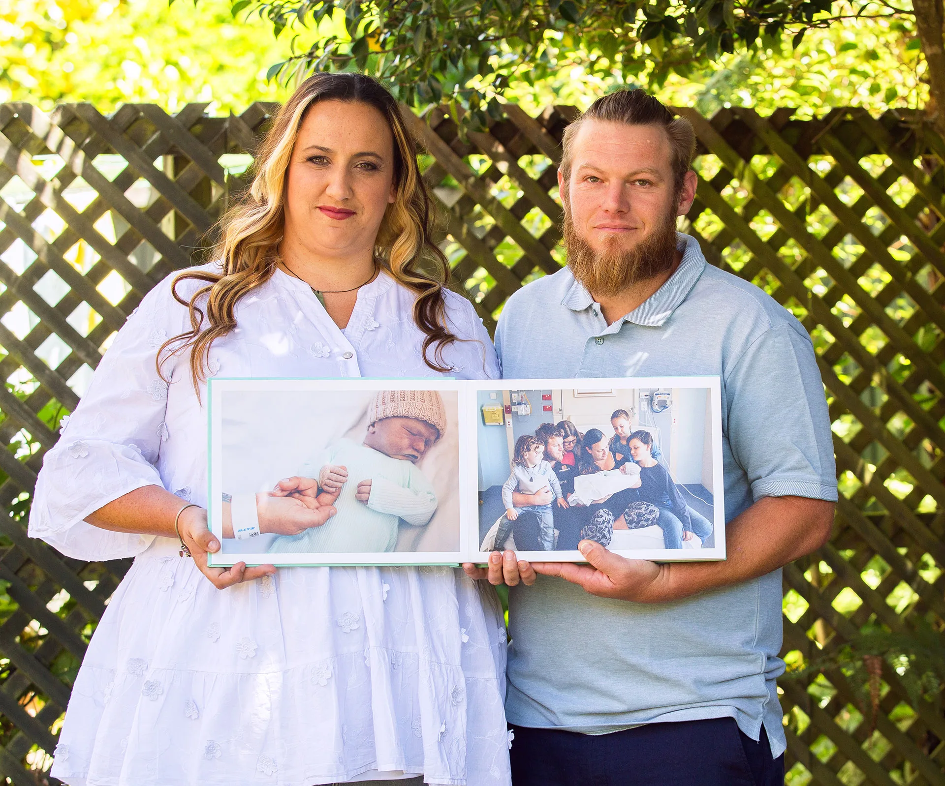kylie ben collins holding pictures of their stillborn son