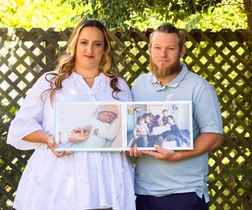 kylie ben collins holding pictures of their stillborn son