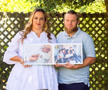 kylie ben collins holding pictures of their stillborn son