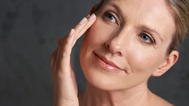 older woman using skincare