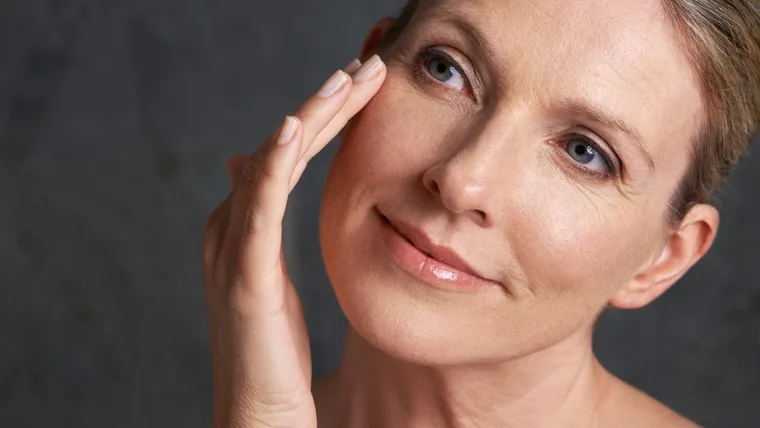 older woman using skincare