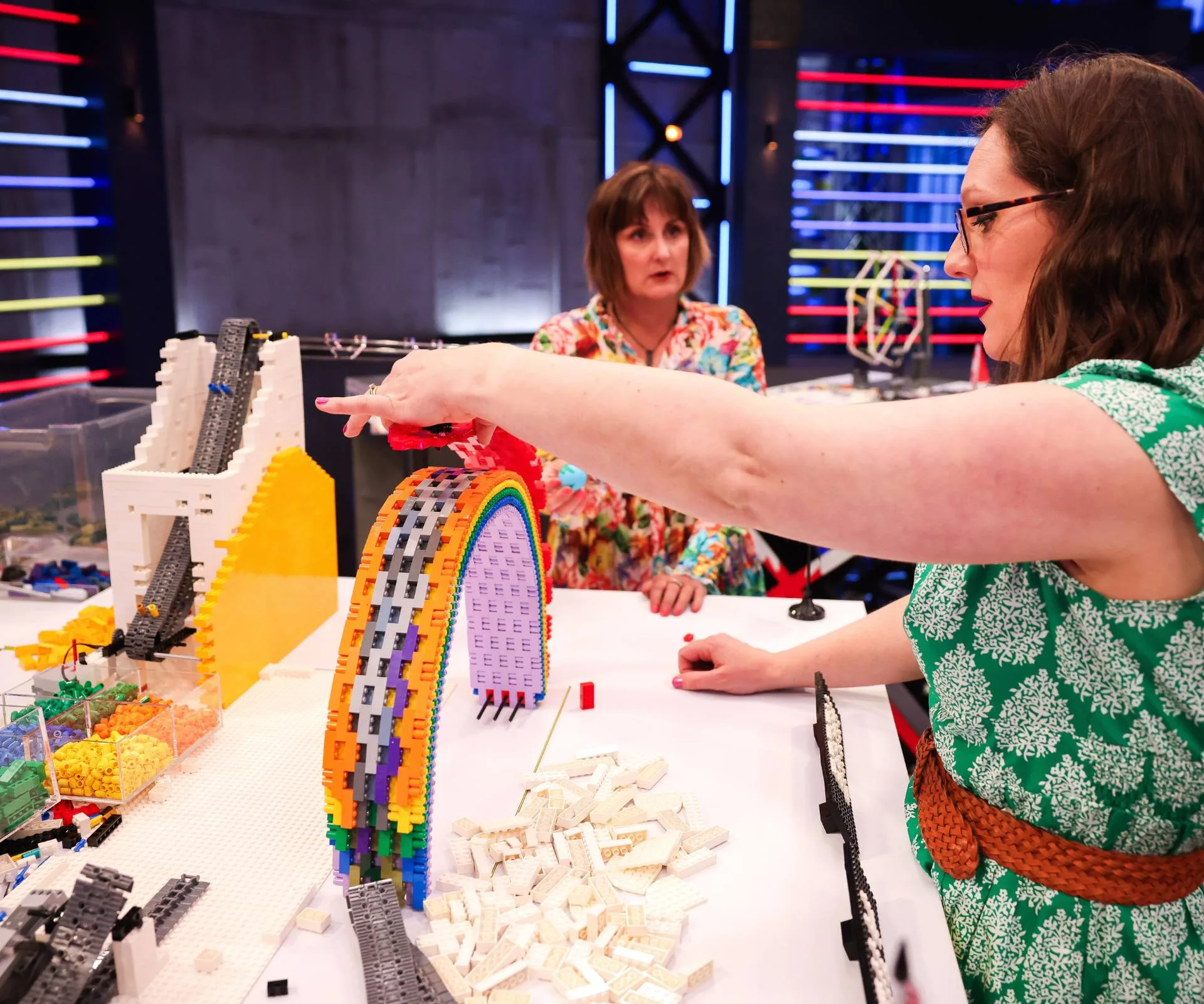 two people building lego 
