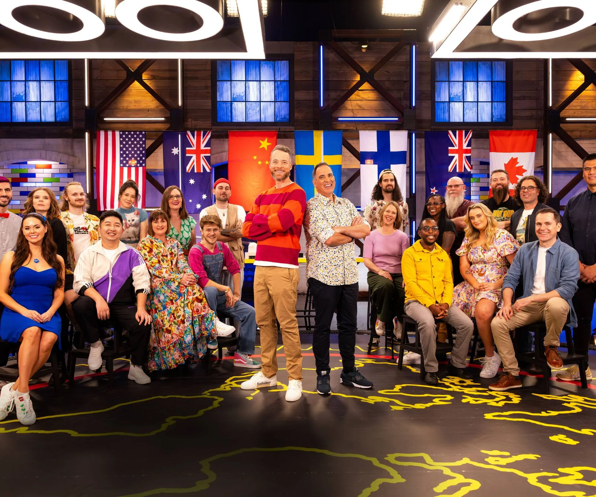group contestants in front of flags