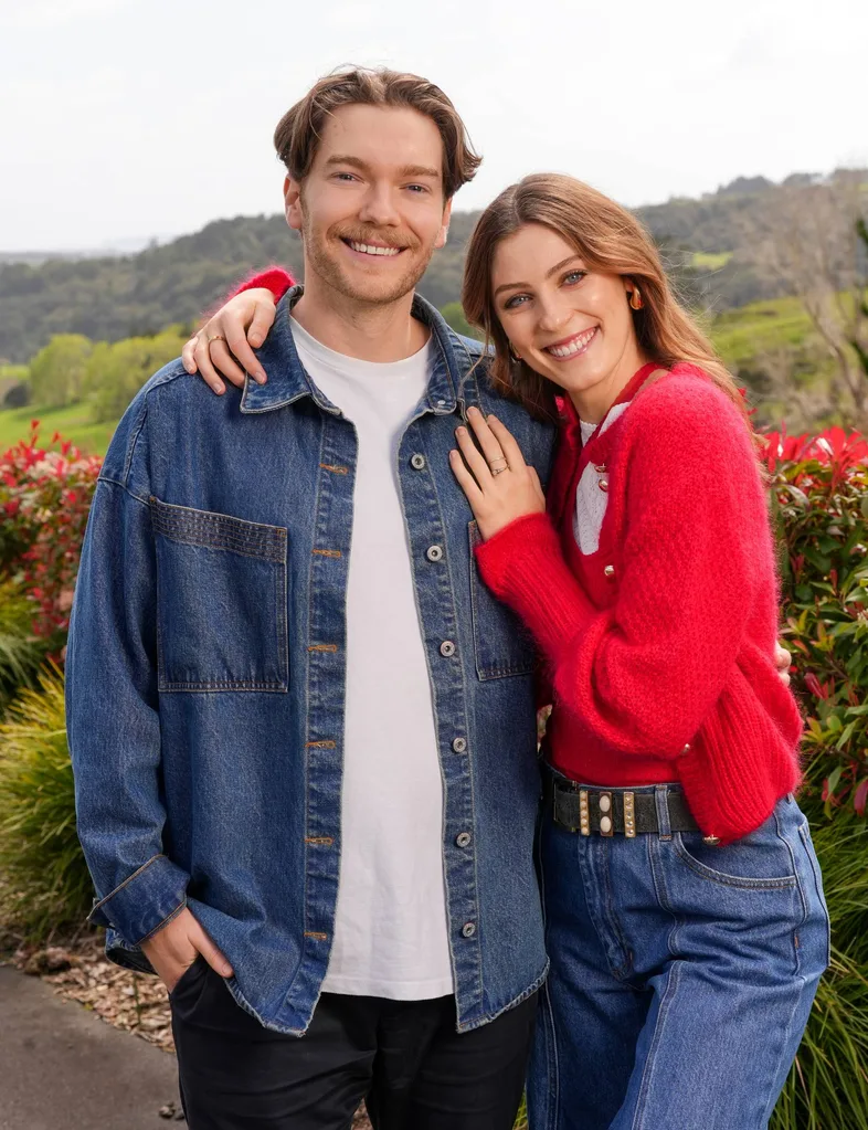 couple posing with denim shirt and red cardigan