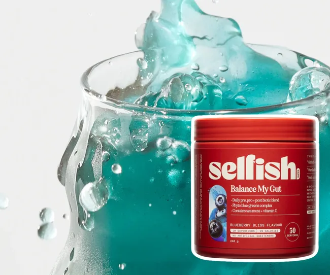 Balance my Gut container against a blue drink background