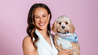 dame lisa carrington holding her dog colin