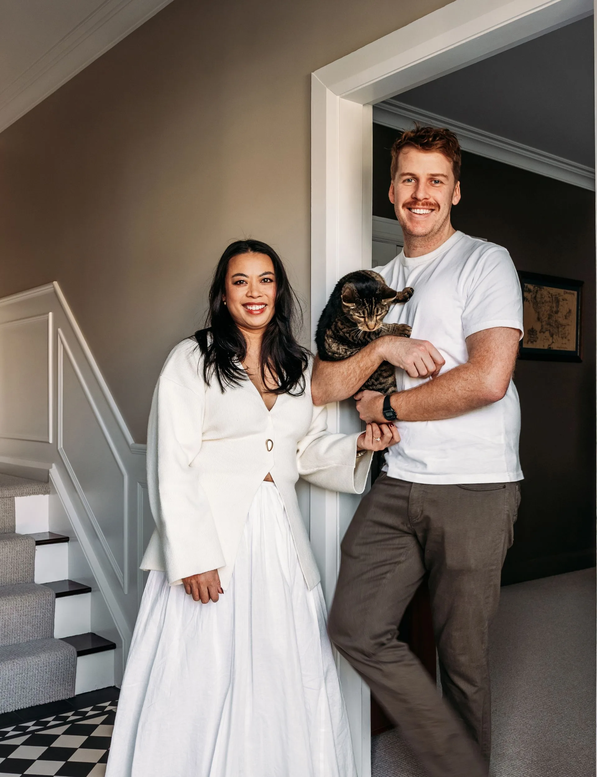 Wellington villa homeowners Kimberly and Tom Bamford and their cat