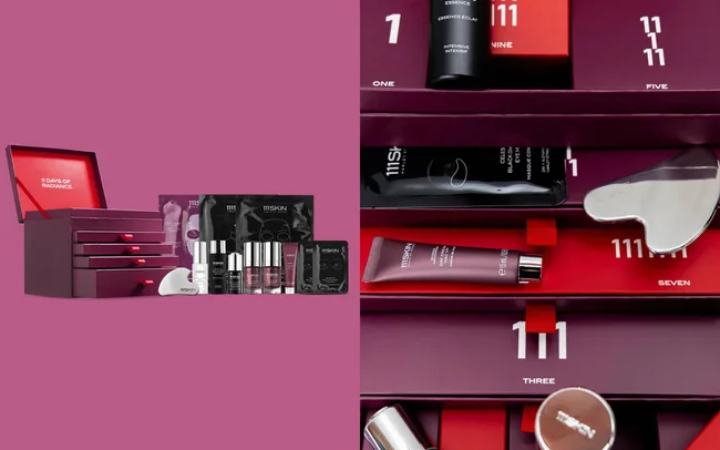 A luxurious skincare advent calendar with burgundy packaging, featuring drawers labelled with numbers, revealing assorted skincare products like creams, serums, and tools.
