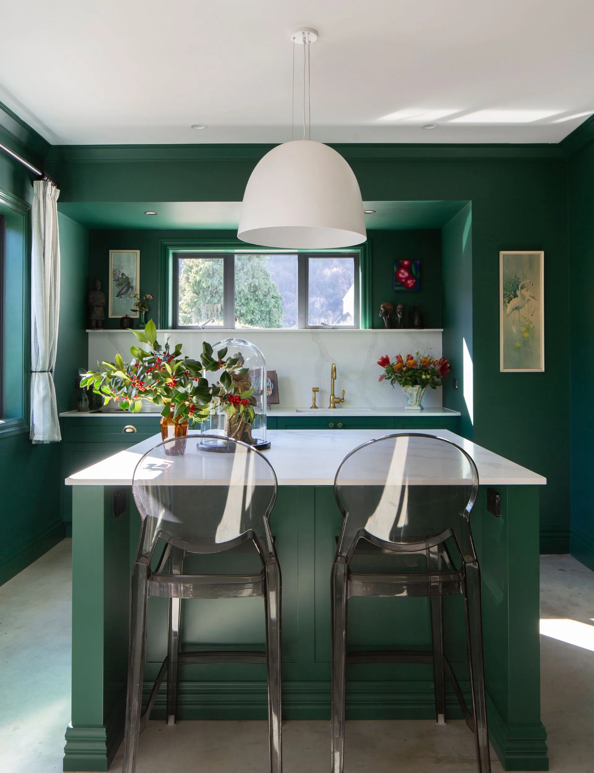 The green kitchen of this Arrowtown home is painted in Resene Bush