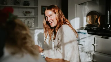 Glowy redheaded woman in kitchen