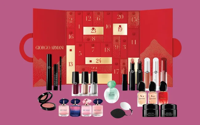 Red Giorgio Armani advent calendar with numbered doors, containing makeup items and fragrances.