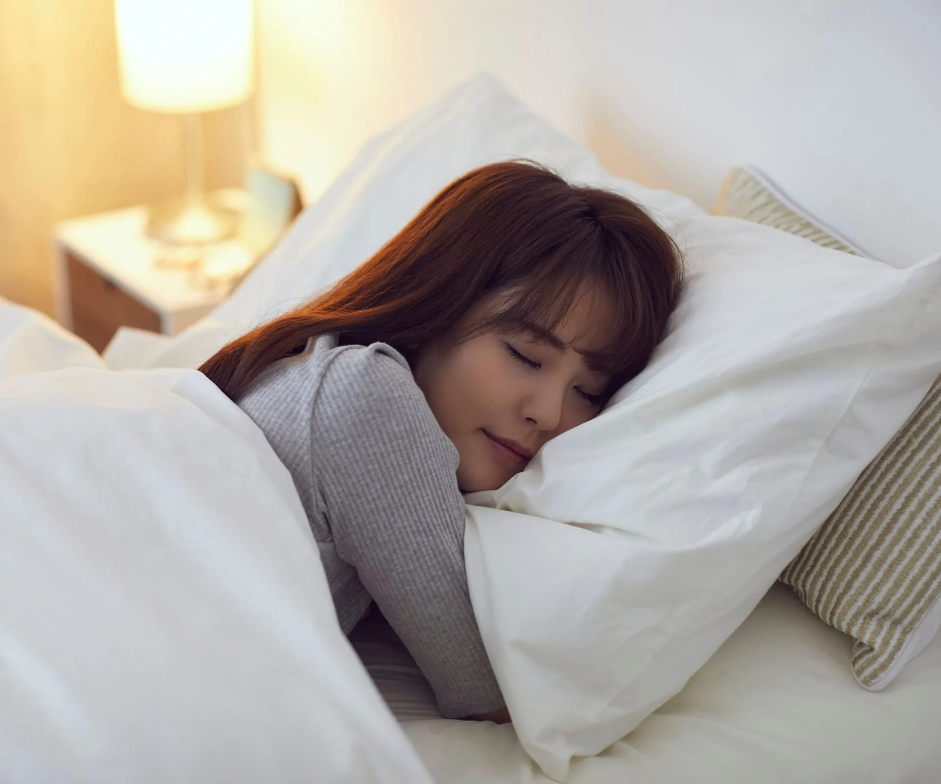 Woman sleeping soundly in bed