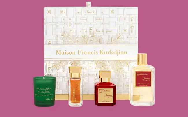 Maison Francis Kurkdjian Advent Calendar featuring perfumes and a candle. The packaging is elegant in gold and white, conveying luxury.