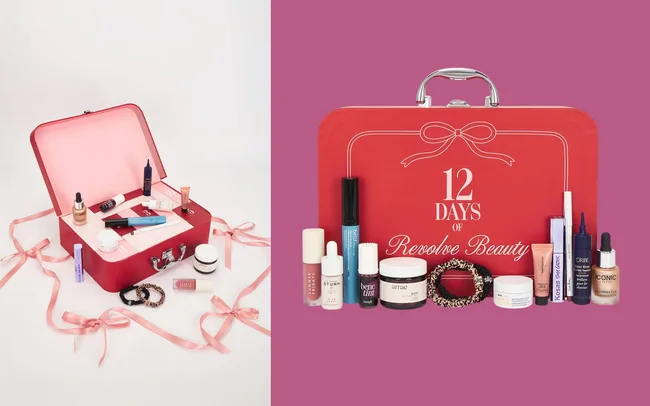 Red suitcase with "12 Days of Revolve Beauty" text, surrounded by beauty products like lip gloss, serums, and creams.