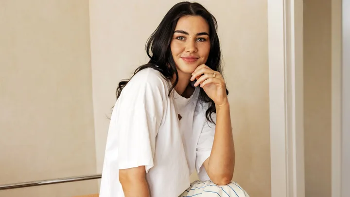 Jess Quinn in white t-shirt