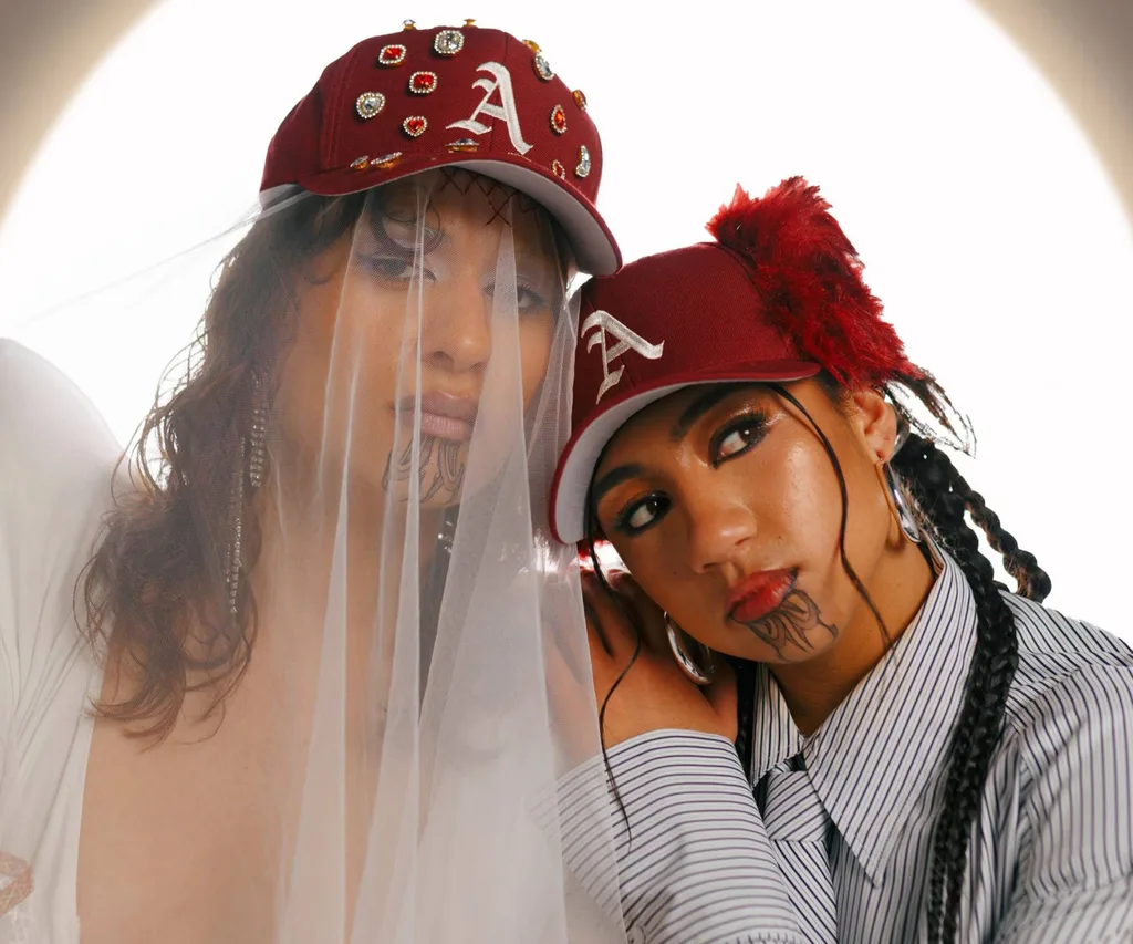 Ahikrāoa leaning on Awa Puna shoulder posing together