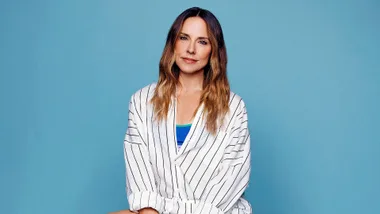 Mel C in pinstripe shirt and blue tank