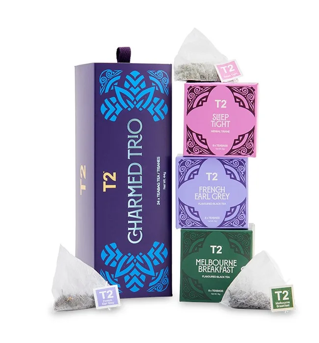 stack of pink and purple boxes of tea
