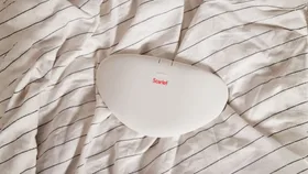 Scarlet heating pad on bedspread