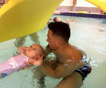 Sonny Bill Williams takes baby Imaan for a swim