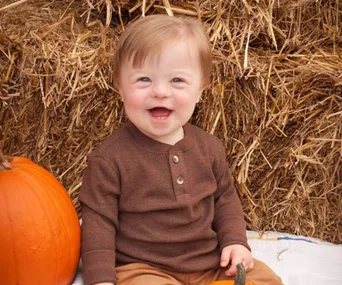 Beautiful two-year-old with Down syndrome passionately recites the alphabet