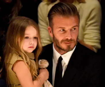 David Beckham defends kissing his kids on the lips