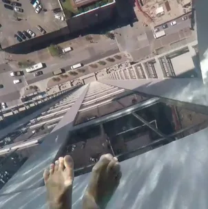 WATCH: Would you swim in this scary glass-bottomed rooftop pool?