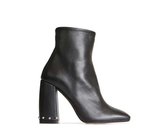 Black leather ankle boot with a high chunky heel and stud detail at the base.