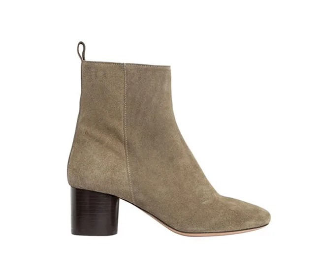 Tan suede ankle boot with a chunky heel on a white background.