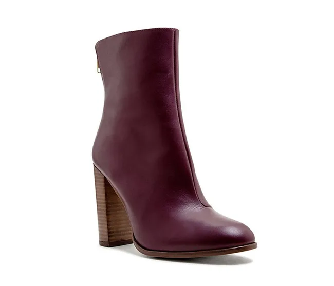 Dark brown leather ankle boot with a high block heel and smooth finish.