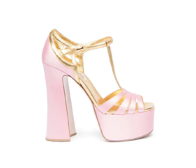 Pink and gold platform high heel shoe with T-strap design.