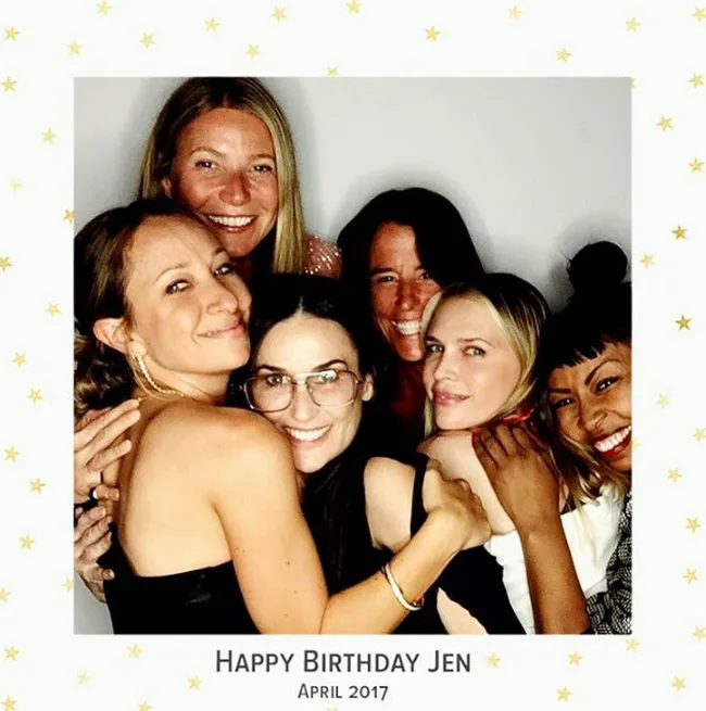 A group of six women smiling and hugging, framed text reads "Happy Birthday Jen, April 2017."