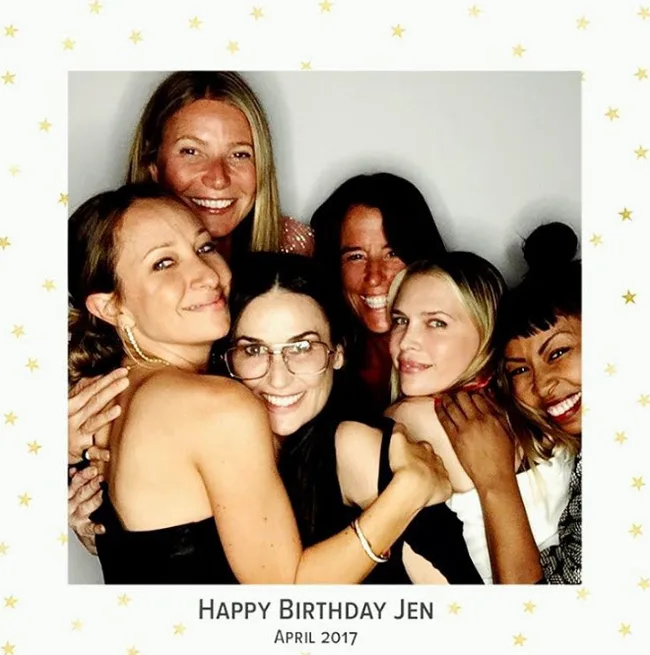 A group of six women smiling and hugging, framed text reads "Happy Birthday Jen, April 2017."