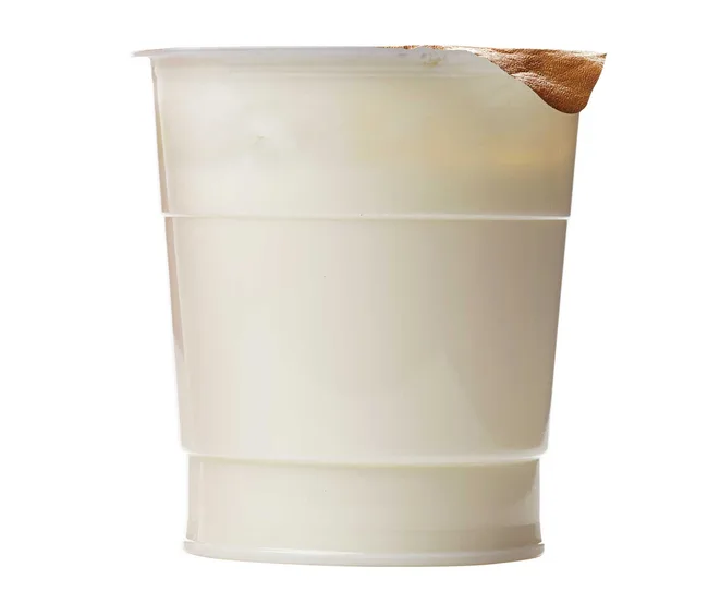 A white plastic cup with a missing section in the top rim.