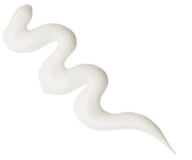 White wavy swirl of cream against a plain background.