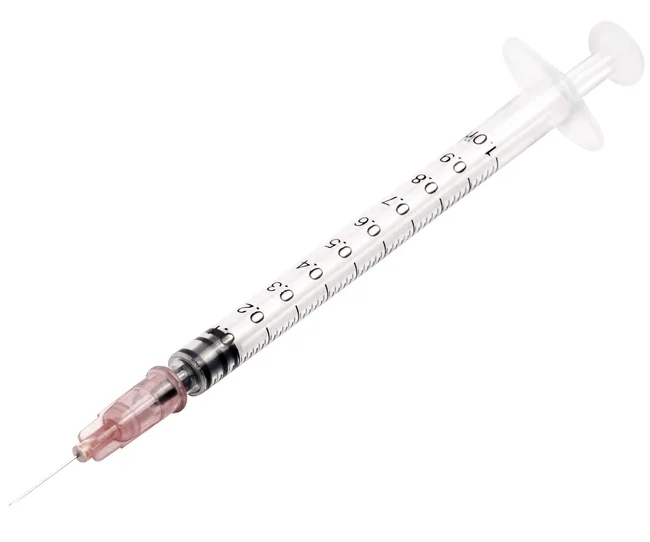 A syringe with a clear barrel, marked with measurements, and a pink needle cap on a white background.