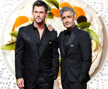 Taika Waititi symbolically claiming an Australian icon for his country on a Pavlova background at The 75th Golden Globes