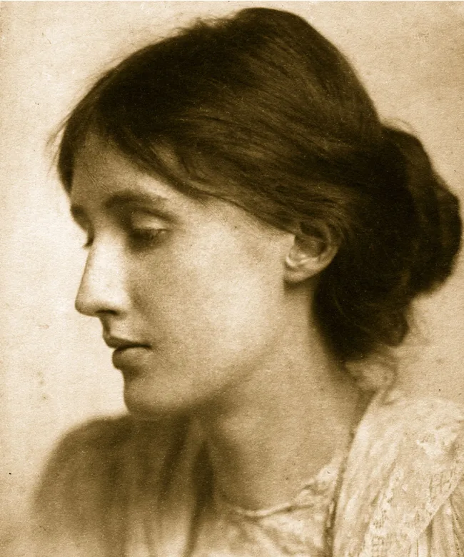 Sepia-toned portrait of a woman with dark hair in an updo, facing left in profile.
