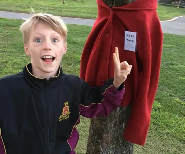 Why we’re all enchanted by the 10-year-old boy leaving warm coats on trees