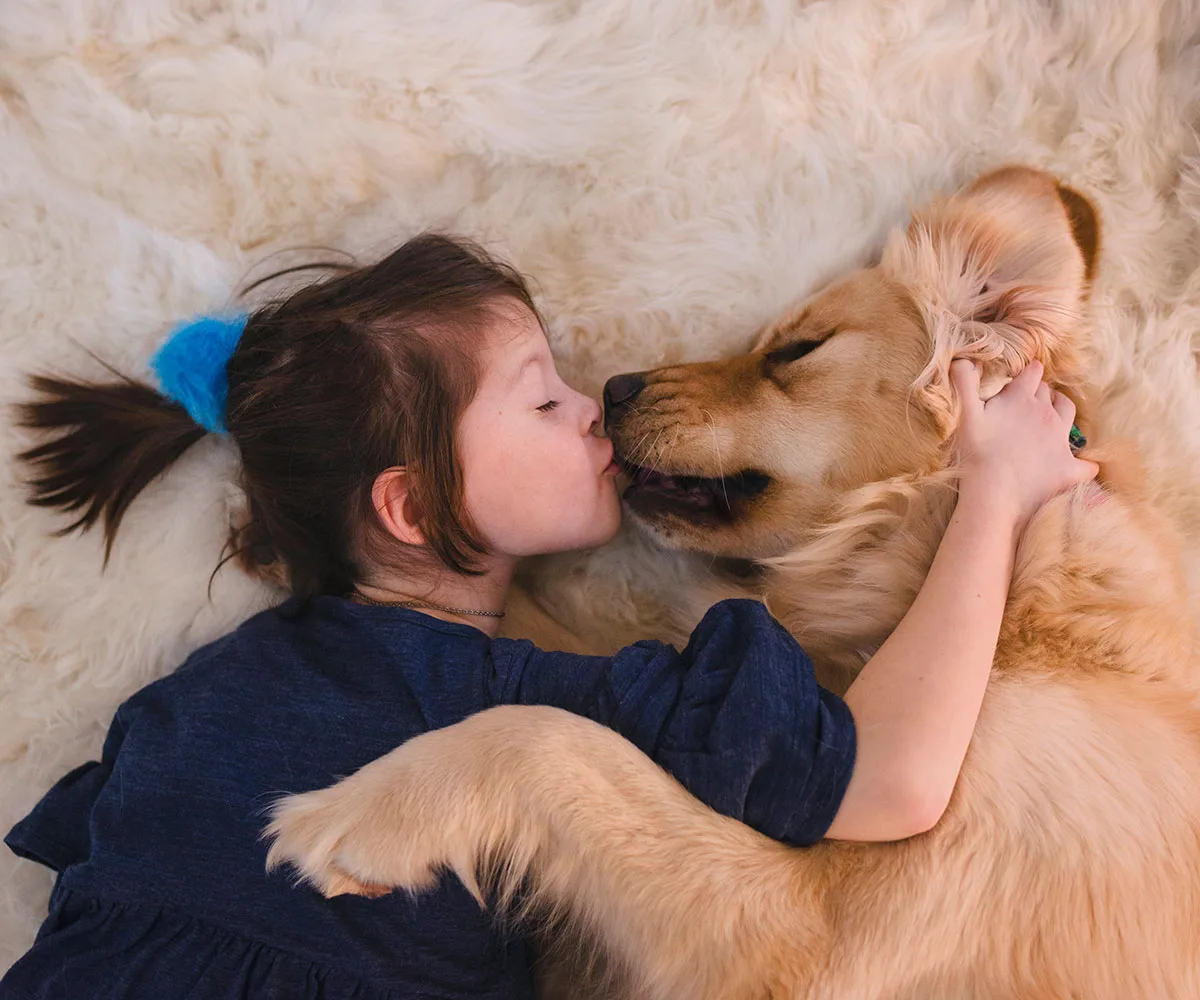 With a dog like this who needs lifeguards! Watch this adorably protective dog pull a little girl from the sea