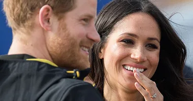Prince Harry smooths down Duchess Meghan’s hair for her when the wind catches it – could this pair be more adorable!