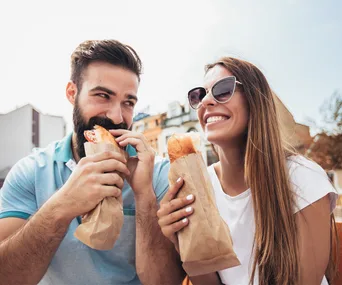 Couple eating baguettes
