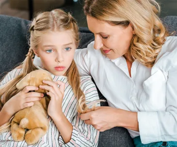 Mother talking to concerned daughter shutterstock