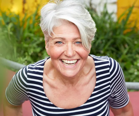 Portrait of happy mature woman in garden