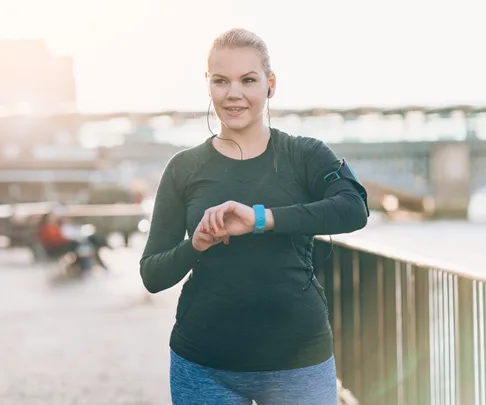 person wearing stripped socks standing on a scale