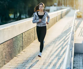brunette woman running