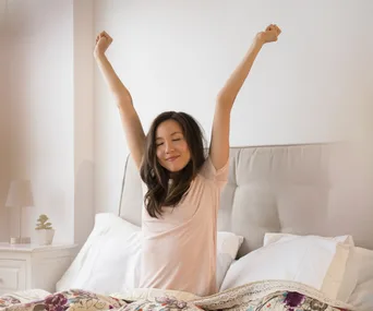 Well rested asian woman walking up