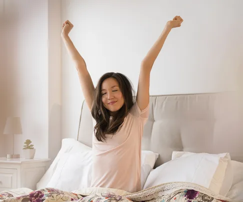 Well rested asian woman walking up
